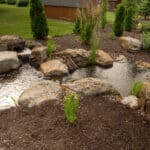 water feature with pond and mountain stream with boulders