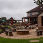 waterfall with koi pond, mountain , boulders, fire pit, flagstone patio and landscaping