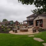 waterfall with koi pond, mountain , boulders, fire pit, flagstone patio and landscaping