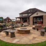 waterfall with koi pond, mountain , boulders, fire pit, flagstone patio and landscaping