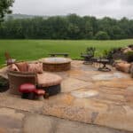 waterfall with koi pond, mountain , boulders, fire pit, flagstone patio and landscaping