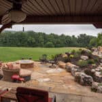 waterfall with koi pond, mountain , boulders, flagstone patio and landscaping