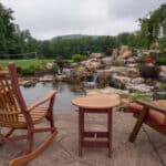 waterfall with koi pond, mountain boulders, and landscaping