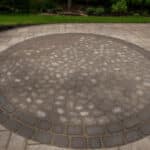 paver walk way with mulch planting beds and sidewalk