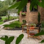 paver walk way with mulch planting beds and sidewalk