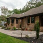 paver walk way with mulch planting beds and sidewalk