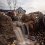 waterfall with mountain boulders