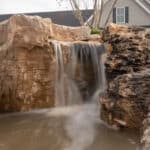 waterfall with mountain boulders