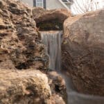 waterfall with mountain boulders