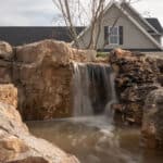 waterfall with mountain boulders