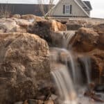 waterfall with mountain boulders