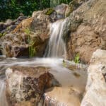 waterfall with mountain boulders