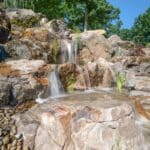 waterfall with mountain boulders