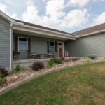 landscaping bed with river gravel and plantings and edging
