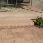 paver patio with natural stone step