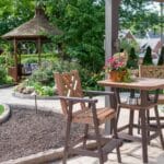 paver sidewalk with pergola and landscaping and edging