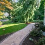 paver sidewalk with mulch planting beds and landscaping