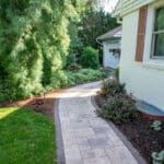 paver sidewalk with mulch planting beds and landscaping