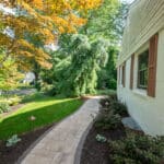 paver sidewalk with mulch planting beds and landscaping
