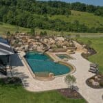 waterfall into rec swim pond with waterslide and paver patio