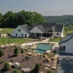 waterfall into rec swim pond with waterslide and paver patio