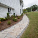 paver side with landscaping and lighting