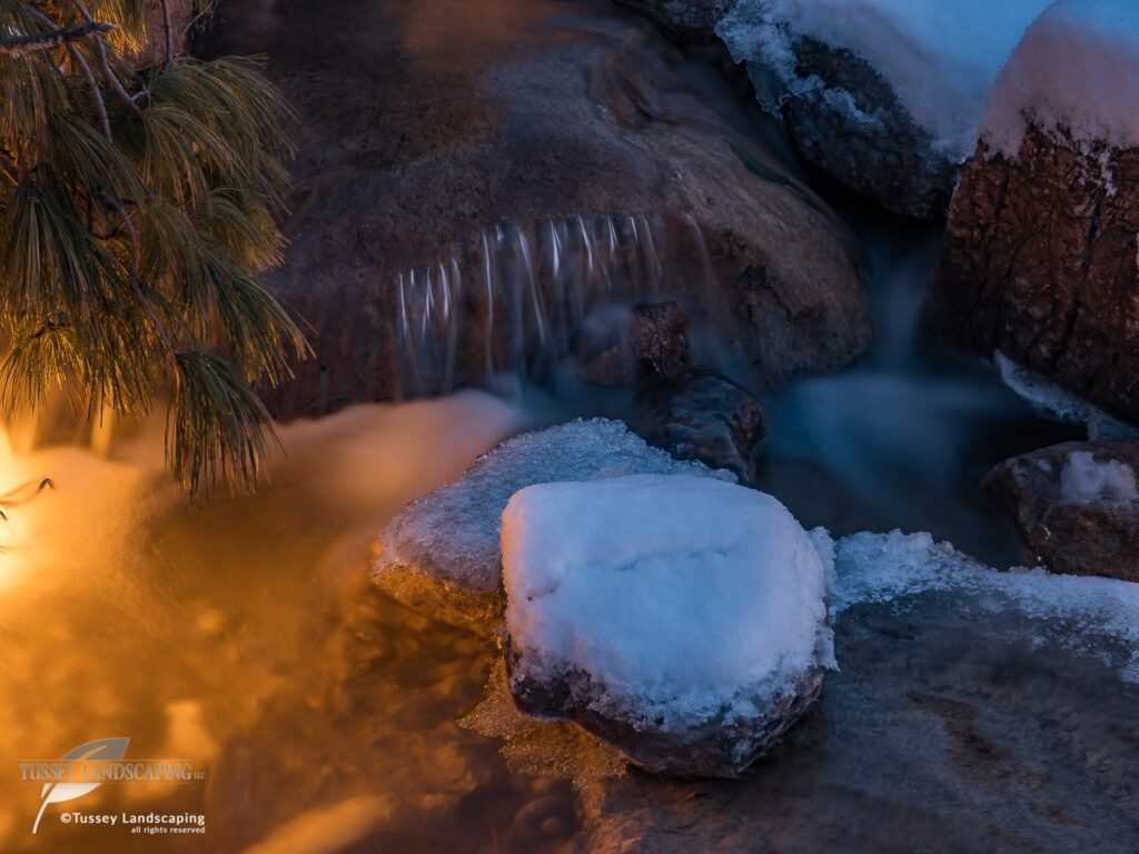 Snow Covered Stone in Stream