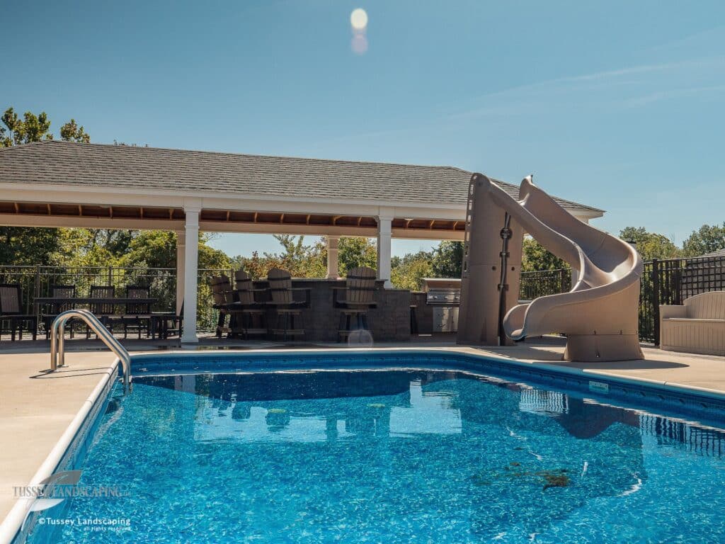 Fiberglass Pool Beside White Vinyl Pavilion