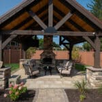 custom fireplace in pavilion on paver patio