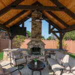 custom fireplace in pavilion on paver patio