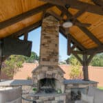 custom fireplace in pavilion on paver patio