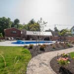 outdoor living space with paver patio and fiberglass swimming pool