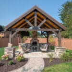 custom fireplace in pavilion on paver patio