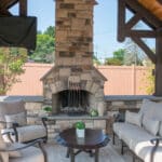 custom fireplace in pavilion on paver patio
