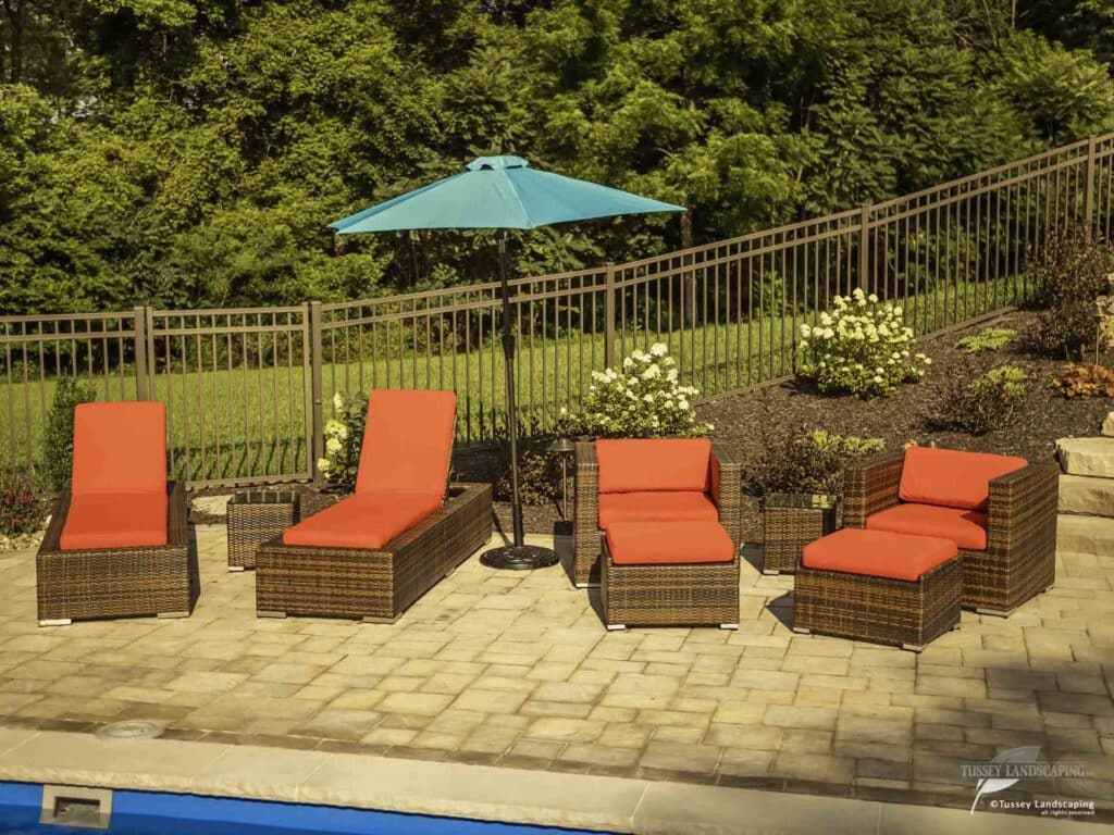 lounge area beside swimming pool in backyard altoona pa