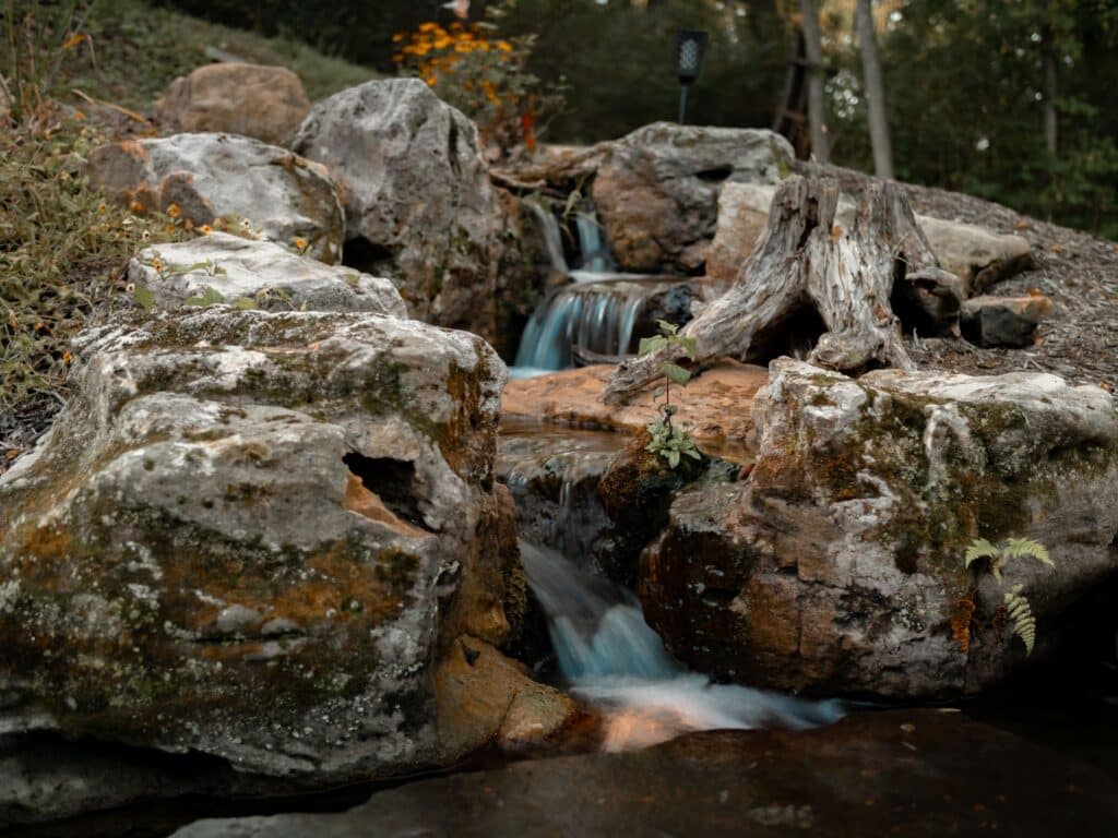 Beautiful Waterfall with Natural Sandstone Mountain Boulders