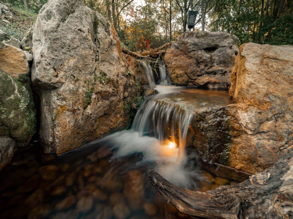 Beautiful Waterfall with Natural Sandstone Mountain Boulders
