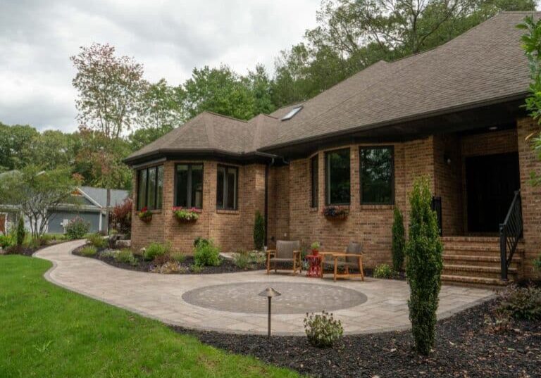 paver walk way with mulch planting beds and sidewalk