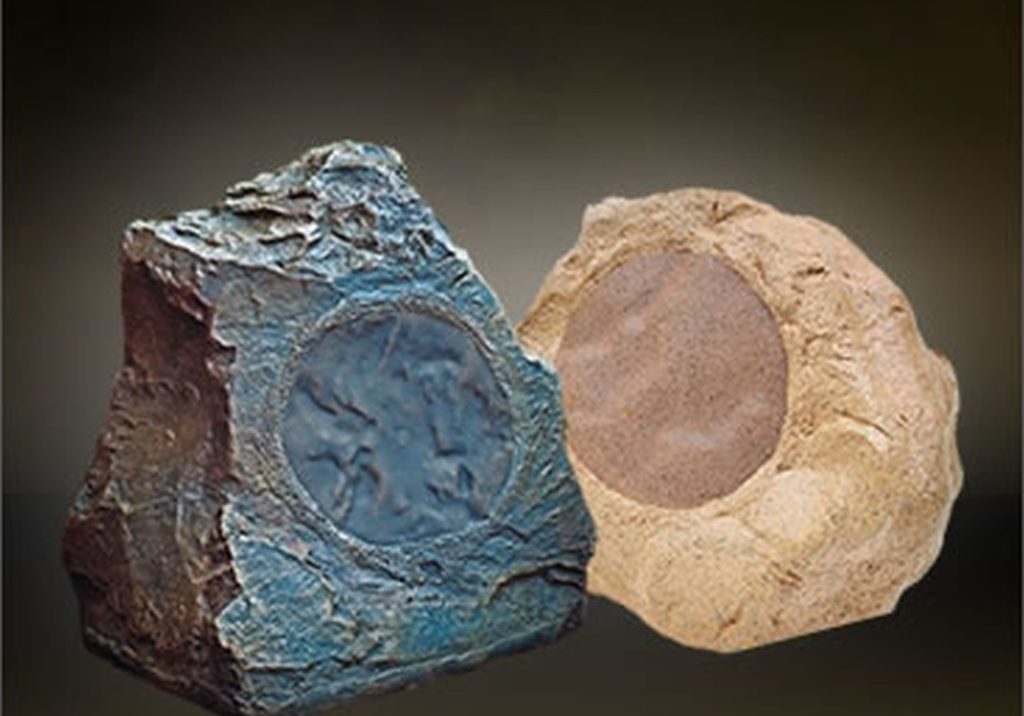 A pair of rocks on a dark background.