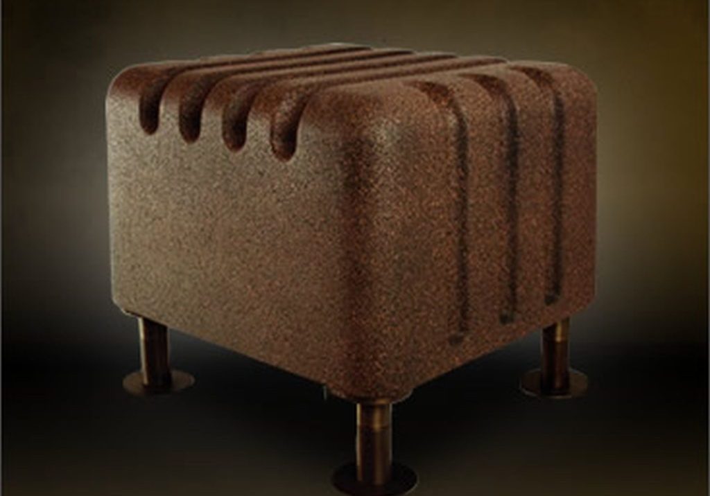 A brown wooden stool on a black background.
