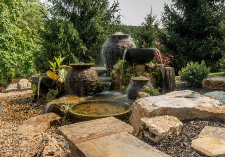 water feature with stacked slate urns and bowls