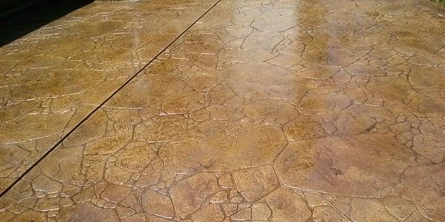 A stamped concrete patio with steps and steps.